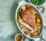 Pork belly with bay, cider & pears in a roasting dish