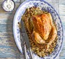 Saffron butter chicken with date & couscous stuffing served on a plate